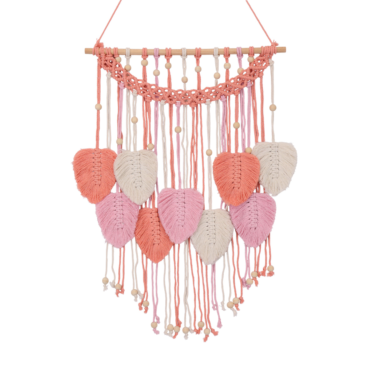 A bohemian-style macrame wall hanging featuring a wooden dowel, pink, peach and white woven cords, and multiple knotted leaf-shaped tassels.